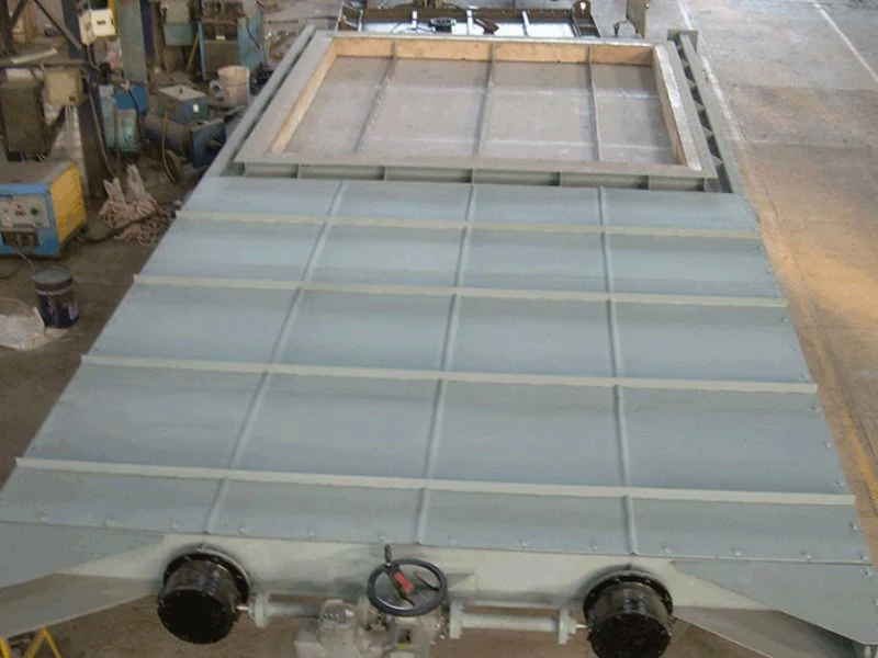 Guillotine damper materials and blade construction
